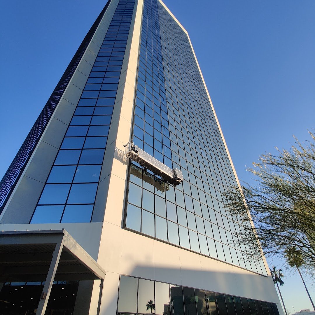 Swing stage on a high-rise building cleaning windows